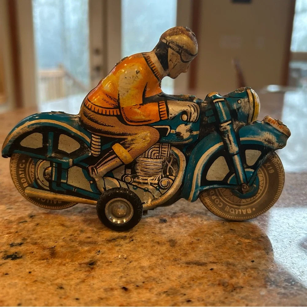 Tin Lithograph Friction Drive Ballon Cordatic toy cycle EN-12-63 Vtg 1950 Era.
